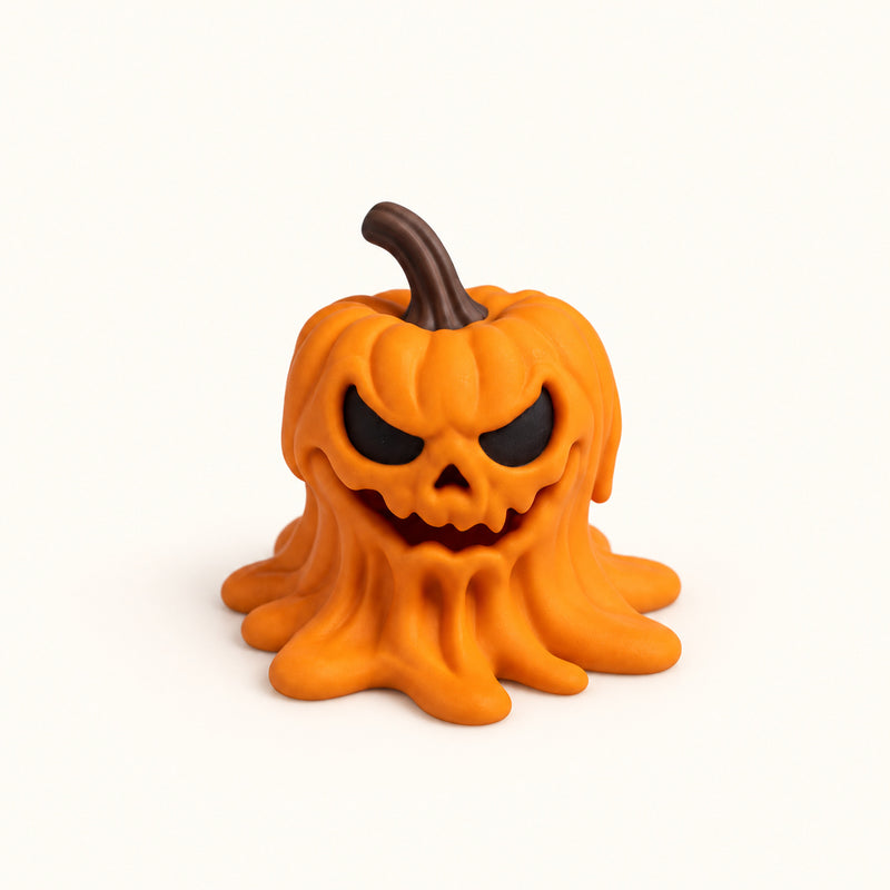 Orange angry pumpkin with a brown stem and a sculpted melting base on a soft white background.