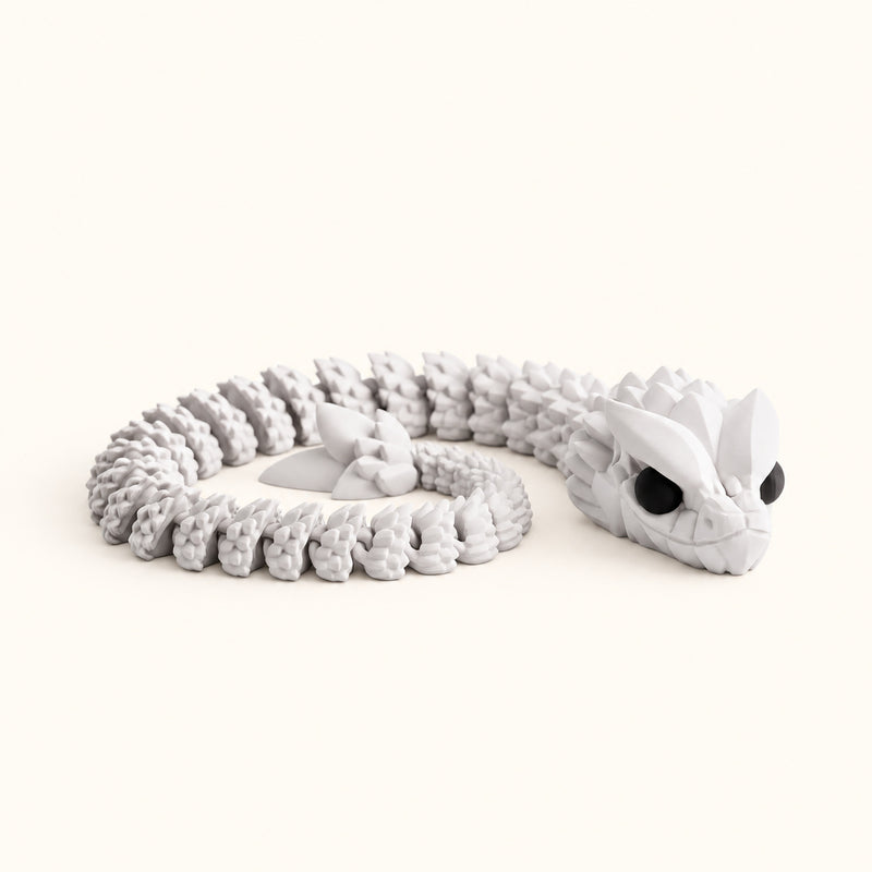 Pale articulated snake curled into a coil with a detailed head on a soft white background.