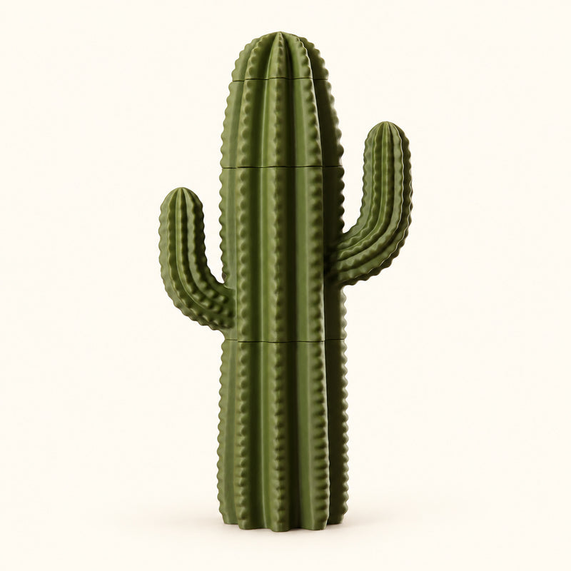 Tall green ribbed cactus decoration with two upright arms on a soft white background.