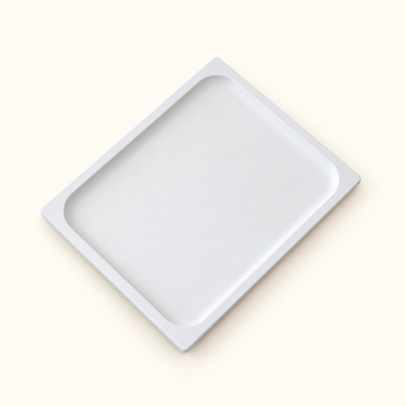 White rectangular couch tray with a shallow raised rim on a soft white background.