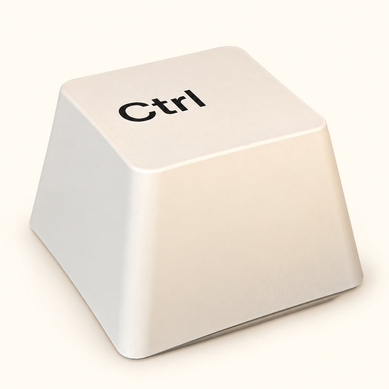 White table lamp shaped like an oversized Ctrl keyboard key on a soft white background.
