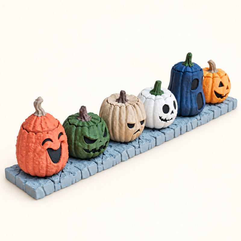 Personalised Pumpkin Clickers showing the pictured product designs on a warm ivory-white background.