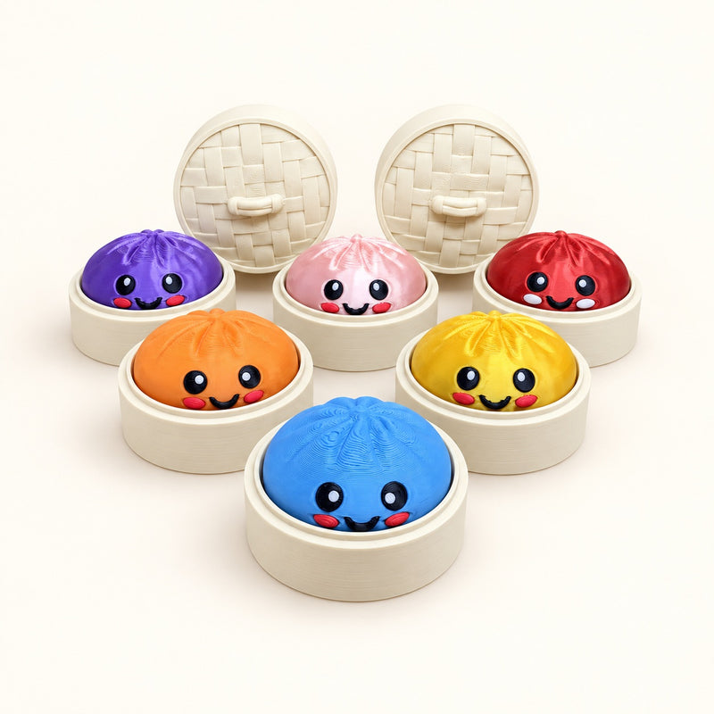 Smiling Dumpling Clickers on a warm ivory background.