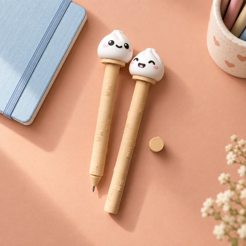 Two tan pens topped with small white dumpling faces in a styled home setting.
