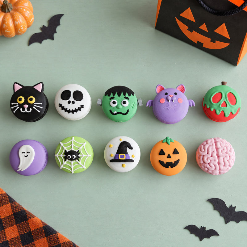Colourful round Halloween character collectibles arranged in two rows in a styled home setting.
