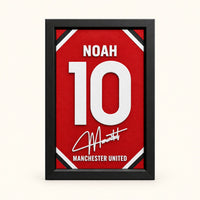 Manchester United jersey frame personalized with NOAH and the number 10 on a soft white background.
