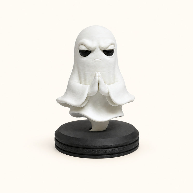 White ghost with folded hands above a black circular pedestal on a soft white background.