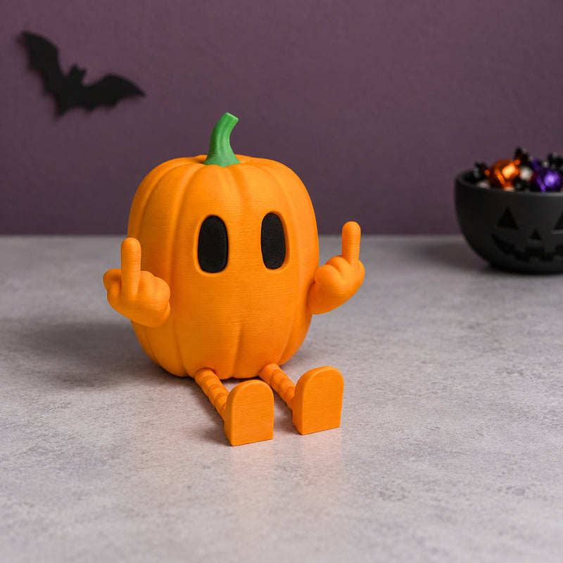 Seated orange pumpkin character with a green stem and raised middle fingers in a styled home setting.