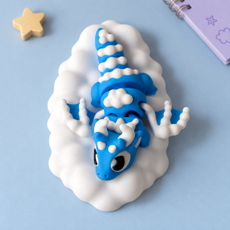 Blue and white dragon arranged on a white cloud-shaped base in a styled home setting.