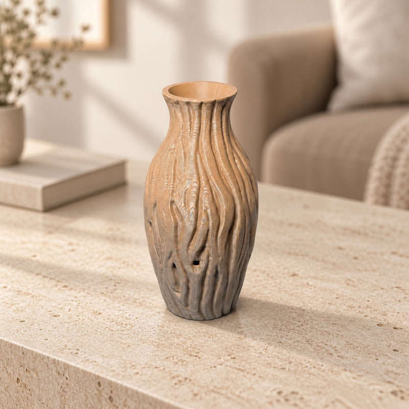 Tan decorative vase with flowing wood-like grooves and a flared neck in a styled home setting.